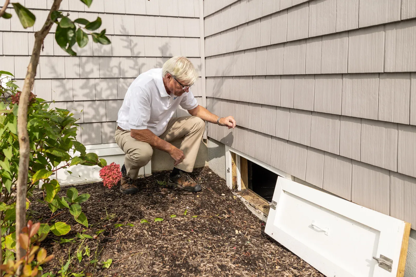 Roofing professional inspecting a roof in Elizabeth, New Jersey