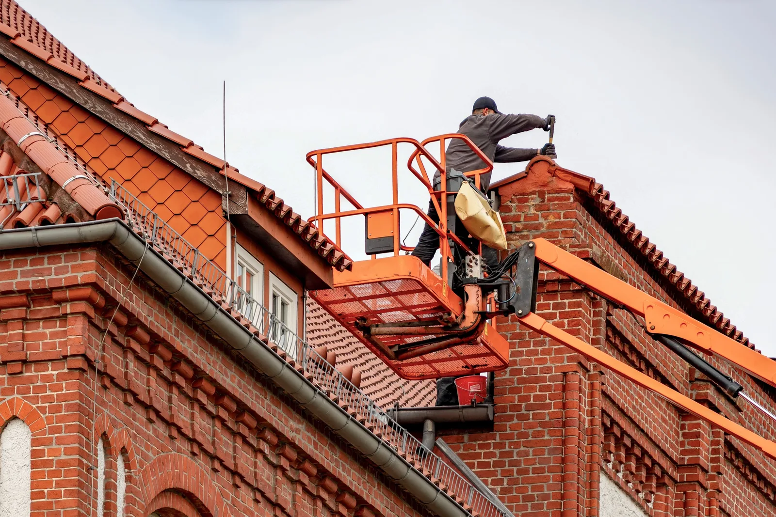 Roofing professional inspecting a roof in Jersey City, New Jersey