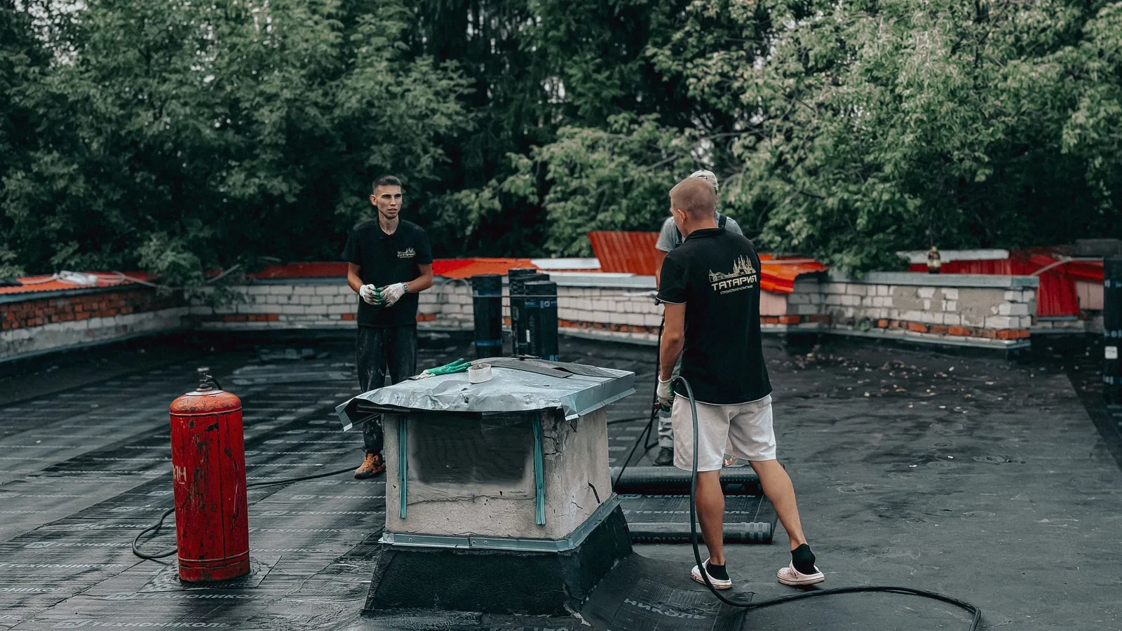 Roofing professional inspecting a roof in Paterson, New Jersey